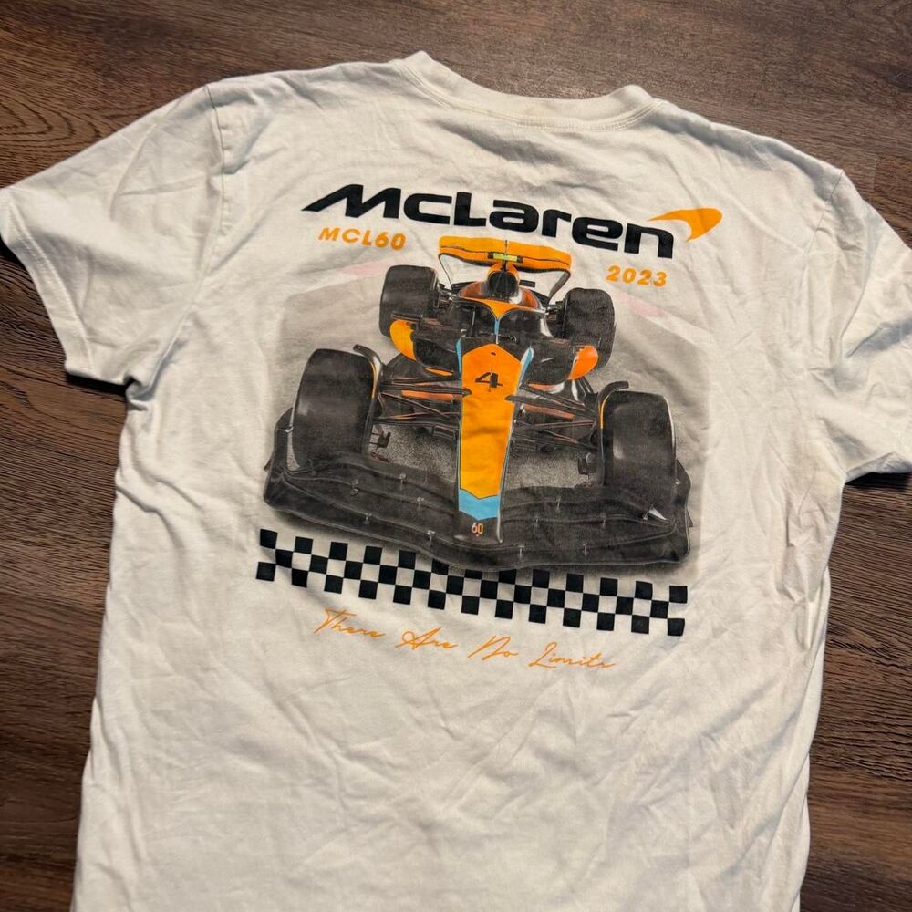 McLaren F1 2023 white t-shirt with orange/black race car graphic and checkered f - Picture 2 of 6